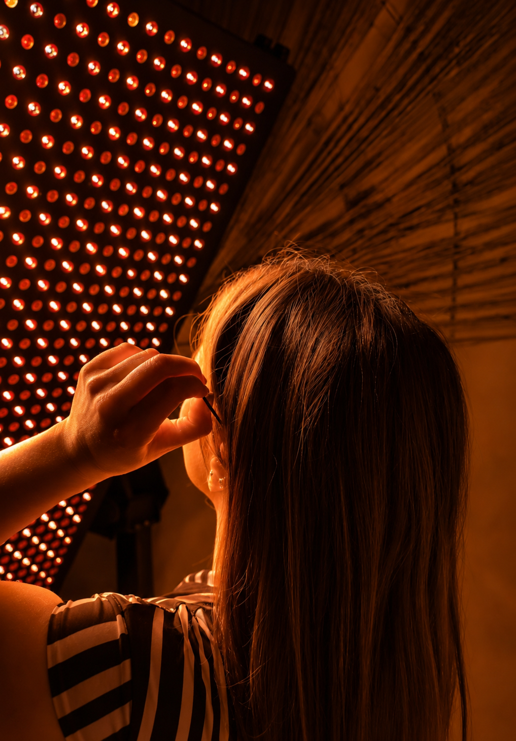 Guest bathed in red light from the full-body panel